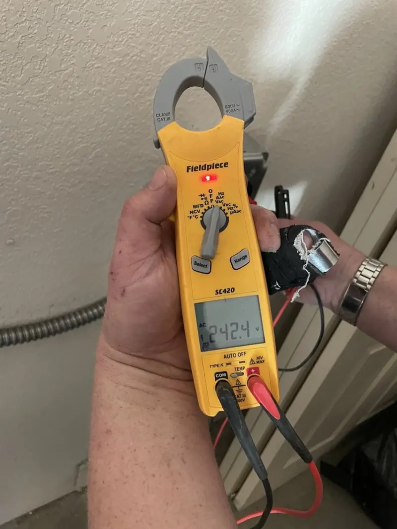 Voltage testing with clamp meter during Recessed Lighting Installation in Germantown